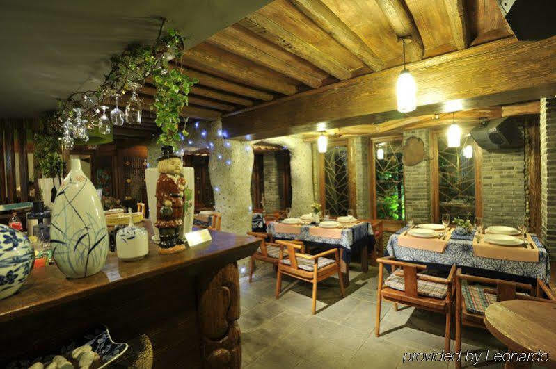 Blossom Hill Inn - Neverland Ліцзян Ресторан фото